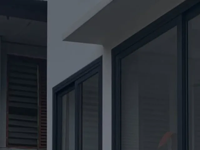 Pintu dan jendela aluminium dark grey di proyek hunian Sukma Jaya, Depok